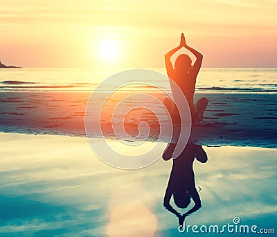 Meditation, serenity and yoga practicing at sunset. Nature. Stock Photo