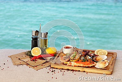 Mediterranean food is on the background of the sea Stock Photo