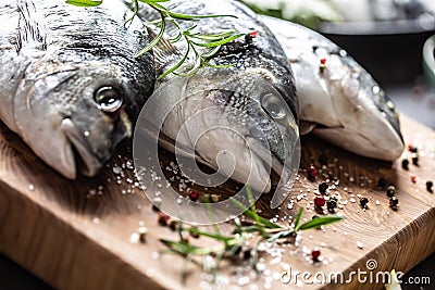 Mediterranean fish bream with spices salt herbs garlic and lemon. Healthy seafood. Concept of healthy sea food Stock Photo