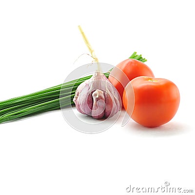 Mediterranean food ingredients: spring onions, garlic and tomato Stock Photo