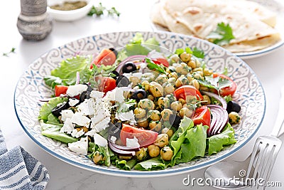 Mediterranean Greek and chickpea salad with fresh vegetables and feta cheese Stock Photo