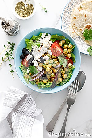 Mediterranean Greek and chickpea salad with fresh vegetables and feta cheese Stock Photo