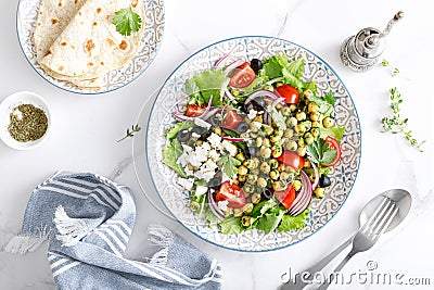 Mediterranean Greek and chickpea salad with fresh vegetables and feta cheese Stock Photo