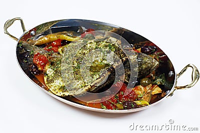mediterranean grilled sea bass fish with tomato, caper, artichoke, olive sauce Stock Photo