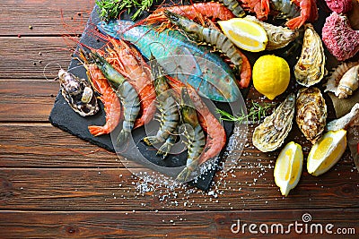 Mediterranean sea cuisine background with a royal and tiger shrimps, oysters, fish Stock Photo