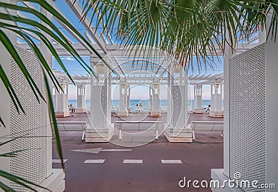 Mediterranean Sea and white colonnade on Promenade des Anglais at sunset in Nice France Stock Photo