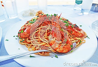 mediterranean seafood - pasta with shrimps at a greek tavern Stock Photo