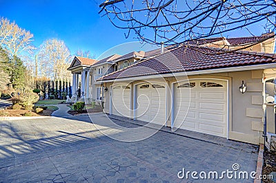 Mediterranean style waterfront home with three garage spaces Stock Photo