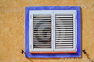 Mediterranean wood window blue frame Stock Photo