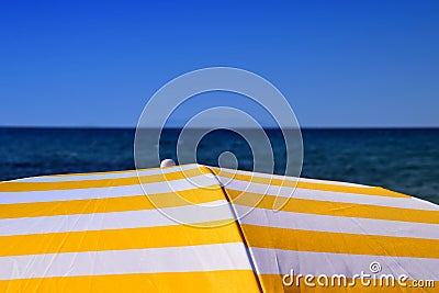 Meditterranean sea and sun umbrella and clear sky Stock Photo