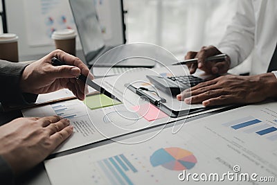 In a meeting between the finance and marketing departments to discuss work plans, two startup employees are brainstorming ideas Stock Photo