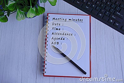 Meeting minutes list text written on notepad. Meeting Concept Stock Photo