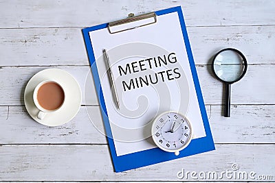 Meeting minutes written on a clipboard. Stock Photo