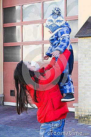 Meeting mother and baby after hospital. discharge of a young mother from the hospital. The concept of coronavirus. Stock Photo