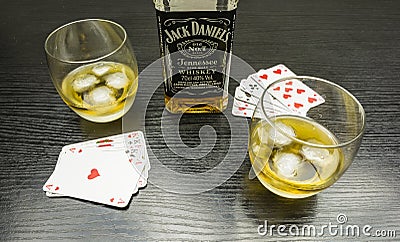Meeting for a poker game. To drink a glass of Jack Daniel`s with Editorial Stock Photo