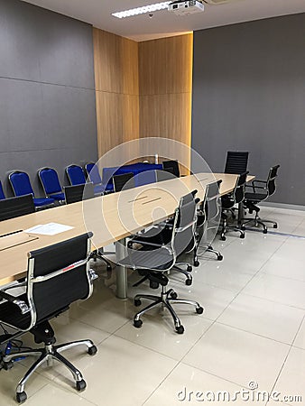 Meeting room in which the chairs are arranged in a mess Stock Photo