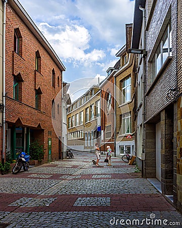 Meeting in a small town on a small street. Mechelen. Belgium. Editorial Stock Photo