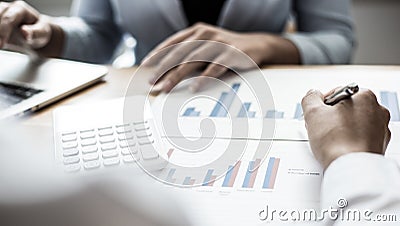 Meeting a team of businessmen, Executives and accountants meeting about the company`s revenue graph in the office with laptops an Stock Photo