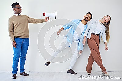 Megaphone, announcement and people in studio to listen to a broadcast message on a gray background. Loud, sound and Stock Photo