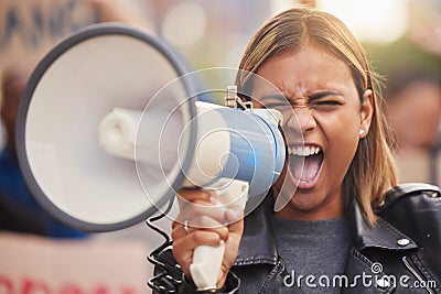 Megaphone, woman and shouting for social change, humanity and justice for equality, on street and stand up. Young female Stock Photo