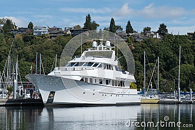 Megayacht reflecting on still waters in the marina. Editorial Stock Photo