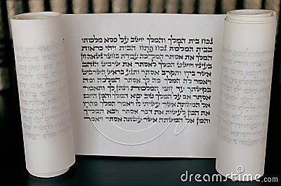 Megillat Esther (Book of Esther) scroll on black backround and talmud. Stock Photo