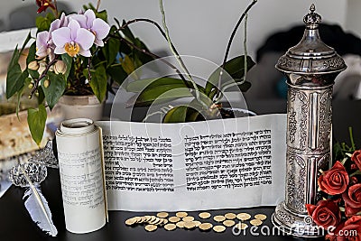 Megillat Esther scroll on beautiful backround and silver case. Stock Photo