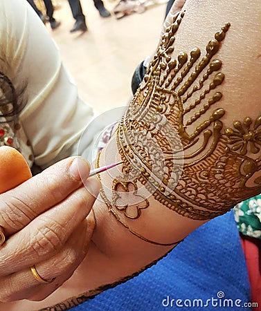 Detailed process of applying intricate pattern Henna on hand Stock Photo