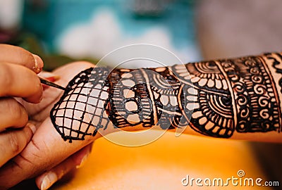 A mehandi design on female hand .Close up image view from top Stock Photo