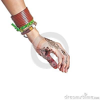 Mehendi or henna tatoo on the female hands in bracelets Stock Photo