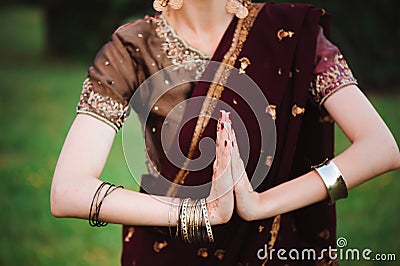 Mehndi tattoo. Woman Hands with black henna tattoos. India national traditions. Stock Photo