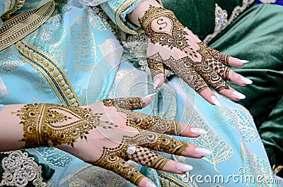 Mehndi tattoo. Woman Hands with black henna tattoos. moroccan national traditions Stock Photo