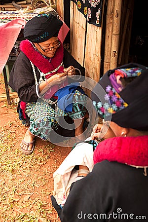 Mein hill tribe embroidery of traditional clothes in Thailand. Editorial Stock Photo