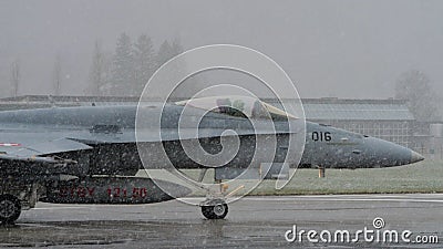 Military pilot in the cockpit ready to take off in the snow with low visibility Editorial Stock Photo