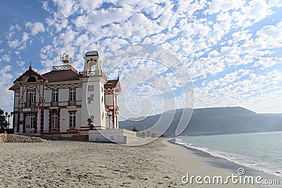 A beachfront building located in the coastal city of Mejillones Stock Photo