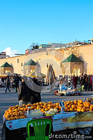 People in national clothing at the Moroccan market, located on El Hedim square Editorial Stock Photo