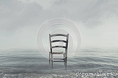 Melancholic scenario of a chair looking toward the infinite Stock Photo