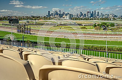 Melbourne, Australia - Flemington racecourse with city skyline in the background as seen from a spectator seat Editorial Stock Photo