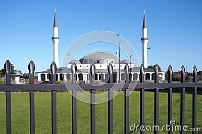 New build Mosque of the Keysborough Turkish Islamic and Cultural Centre behind a tall steel fence at a road near Melbourne Editorial Stock Photo