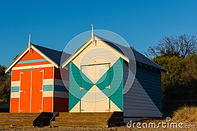 Melbourne, Australia - March 31, 2018: Colourful bathing boxes at Brighton Beach, a popular inner city beach. There are 82 bathing Editorial Stock Photo