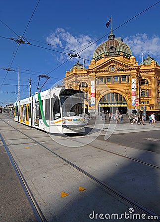 Melbourne public transport tram passing the historic Flinders Street station Editorial Stock Photo
