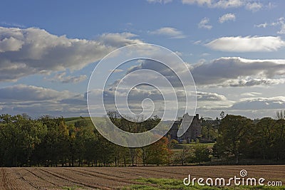 Melgund Castle hidden amongst the trees of a small valley within Farmland near to Abetlemno. Stock Photo