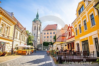 Melnik, Czech Republic - 29.07.2020: City landscape, an old city street at sunset with numerous cafes and the high clock tower of Editorial Stock Photo