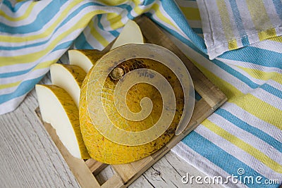 Melon on bright tablecloth Stock Photo