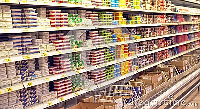 Melted cheese on supermarket shelves Editorial Stock Photo