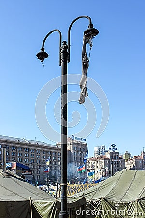 Melted plafond on a street lamp, green tents, flags on the Maidan Nezalezhnosti Editorial Stock Photo