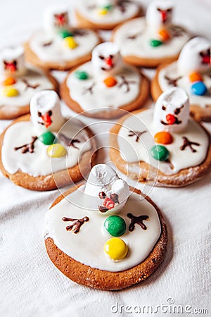 Melted snowmans - idea for decorating traditional ginger christmas cookies Stock Photo