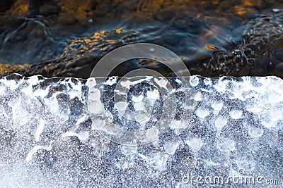 Melting ice on the river in spring. Ice drift time. Natural structure. Needles in the sun Stock Photo
