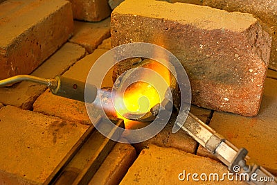 Melting metal in a jewelry workshopMetal melting Stock Photo