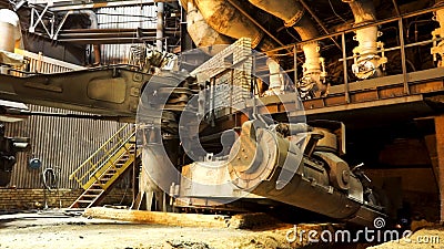 Melting of metal in a steel plant, heavy metallurgy concept. Stock footage. High temperature in the melting furnace. Stock Photo